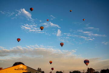 Sunset Soiree: Hot Air Balloons Over Market