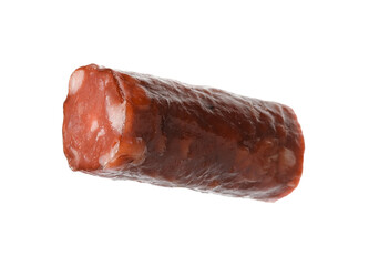 Piece of thin dry smoked sausage isolated on white