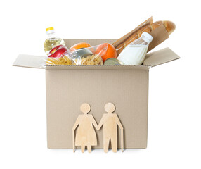 Humanitarian aid for elderly people. Cardboard box with donation food and wooden figures of couple...