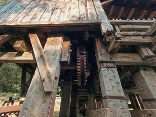 Obraz premium Restored version of an old saw and grist mill on the river. Located on the Sangamon River in Petersburg, Illinois, close to Lincoln's New Salem State Historic Site. Partial View.