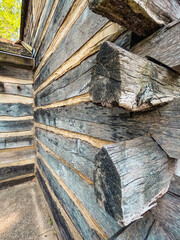 Old-Fashioned Log Cabin Closeup. Closeup views of the corner of an old-fashioned log cabin style home.