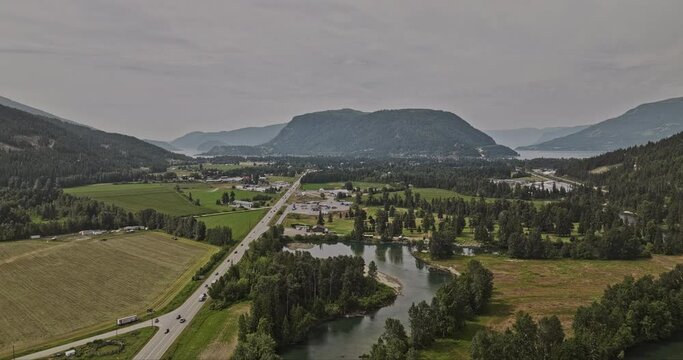 Sicamous BC Canada Aerial v1 flyover Eagle River capturing picturesque landscape featuring agricultural farmlands, townscape and Shuswap and Mara Lakes views - Shot with Mavic 3 Pro Cine - July 2023