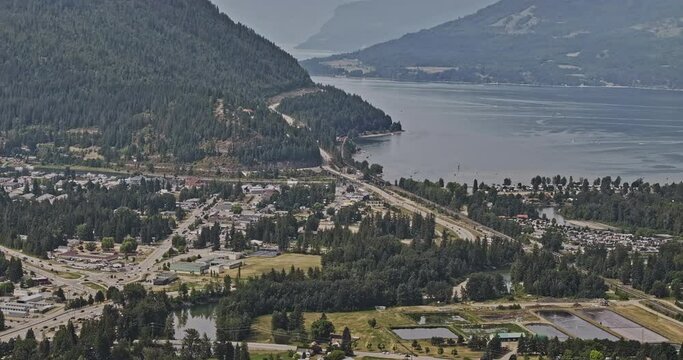 Sicamous BC Canada Aerial v2 zoomed view drone flyover town center capturing forested mountains and pristine waters of Shuswap Lake and Mara Lake - Shot with Mavic 3 Pro Cine - July 2023