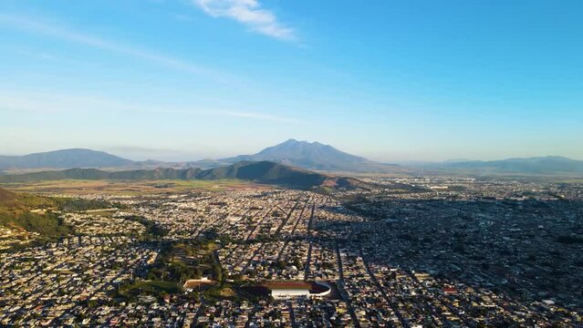 City of Tepic, Nayarit surrounded by hills. In the center, Sanganguey volcano. Aerial