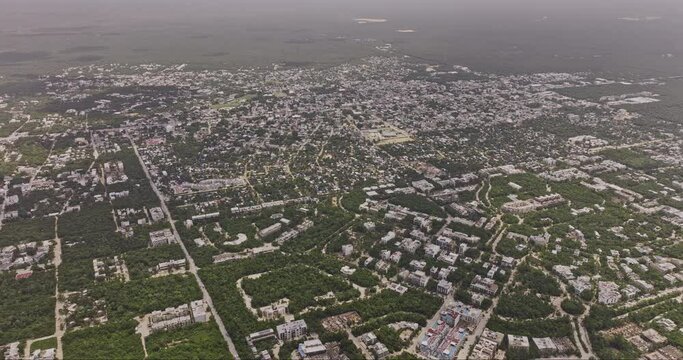 Tulum Mexico Aerial v7 high altitude birds eye view drone flyover luxury neighborhood capturing the town center, La Veleta and ocean views from above - Shot with Mavic 3 Pro Cine - July 2023