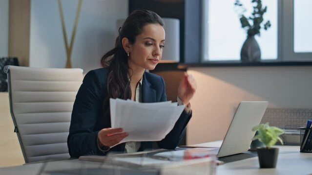Busy woman study documents creative office closeup. Businesswoman typing laptop