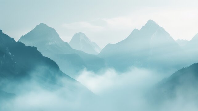 A hazy and blurred background image featuring towering mountains veiled in a thick fog evoking a sense of mystery and wonder. .