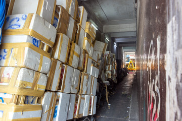 A narrow passage with stored polystyrene boxes, Bangkok, Thailand
