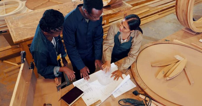 People, wood and workshop design on paper for teamwork collaboration for furniture project, manufacturing or production. Man, women and building contractor with lumber carpentry, repair or handmade