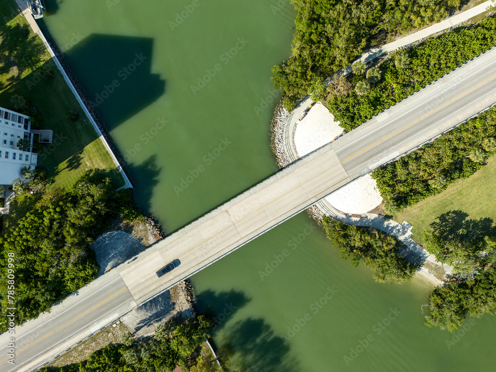 Wall mural bridge over a water way along a gulf coast beach