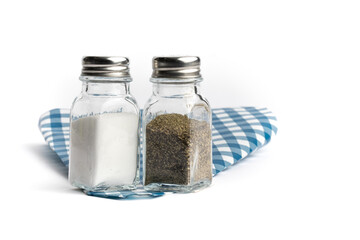 diner style salt and pepper shakers on a blue sandwich paper isolated on white
