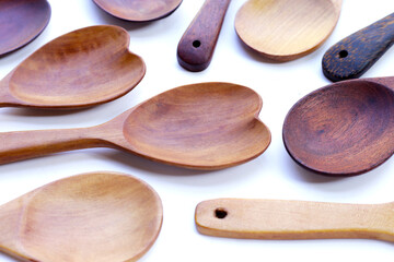 Wooden spoon on white background.