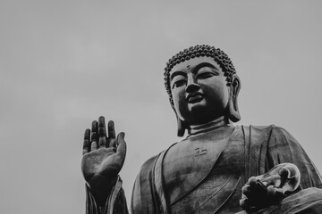 Giant Buddha Statue with Raised Hand in Monochrome at Lantau Island