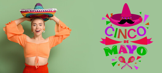 Pretty young woman with sombrero on green background