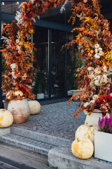 Halloween decorated outdoor cafe or restaurant terrace in America or Europe with pumpkins...