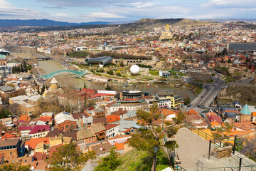Beautiful view of Kura river and Bridge of Peace in Tbilisi, Georgia - obrazy, fototapety, plakaty