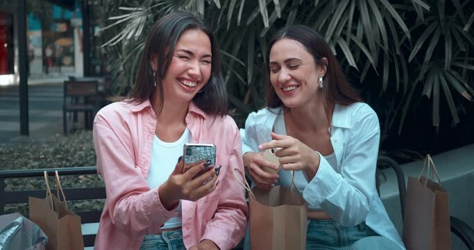 Close-up view on two women friends on bench chatting using phones engaged positive communication. Positive communication reflects joy friendship Positive communication sign happiness elegance.