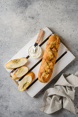 garlic baguette on a gray background