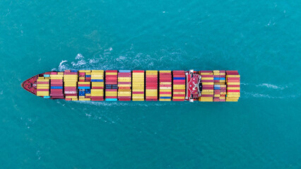Top view Cargo Container ship the ocean ship carrying container and running for import export concept technology freight shipping by ship . aerial top of Container Vessel running in green sea. - obrazy, fototapety, plakaty