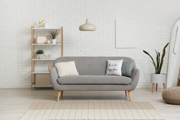 Interior of living room with stylish painting and sofa - obrazy, fototapety, plakaty