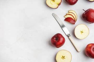 Cut fresh red apples on white background