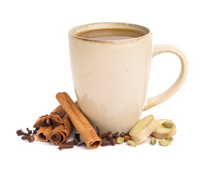 Cup of delicious masala tea with different spices on white background