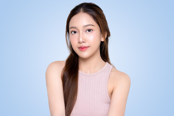 Beautiful young Asian woman with healthy and perfect skin on isolated blue background. Facial and skin care concept for commercial advertising.