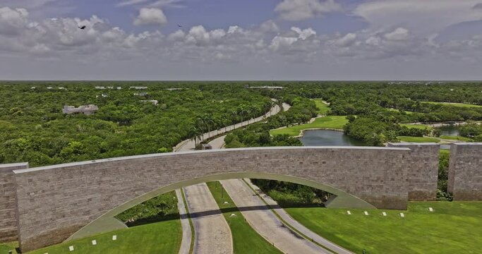 Akumal Mexico Aerial v18 drone flyover the entrance of golf course capturing the lush landscape of Mayan jungle, natural lakes and cenotes - Shot with Mavic 3 Pro Cine - July 2023