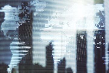 Double exposure of abstract digital world map on modern skyscrapers background, research and...