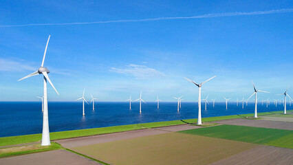 offshore windmill park and a blue sky, windmill park in the ocean. Netherlands Europe
