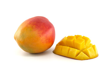 Ripe mango fruit and cubed cut half mango isolated on white
