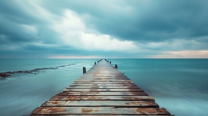 Pier with wooden walkway leading to the water. The sky is cloudy and the water is calm - Powered by Adobe