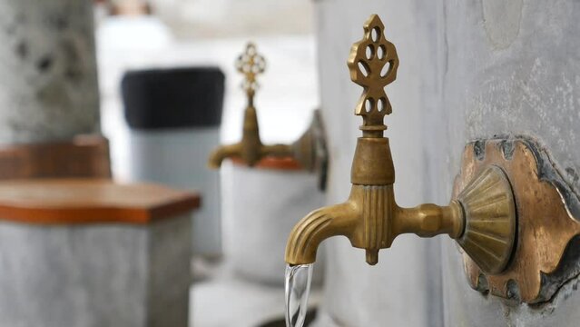 water pouring from a faucet tap outdoor in istanbul 