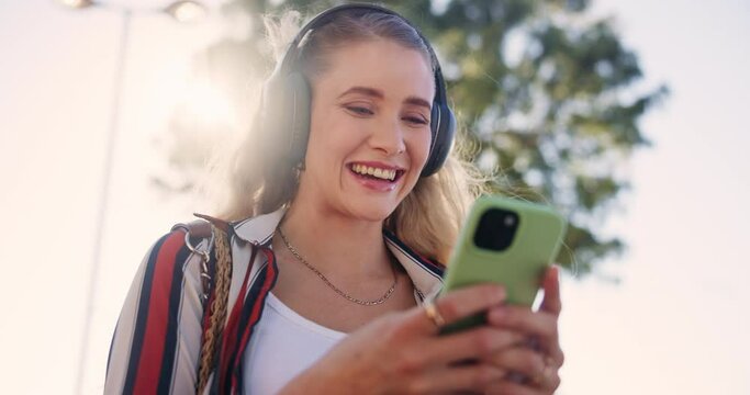 Woman, phone and laugh with funny, video or joke for radio or podcast with travel. Student, headphones and app for social media, communication and technology with humor and internet meme or music