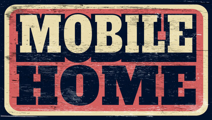 Aged and worn vintage mobile home sign on wood