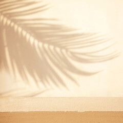 Selective focus.sandstone top product display platform in tropical design with shadow palm leaf on...