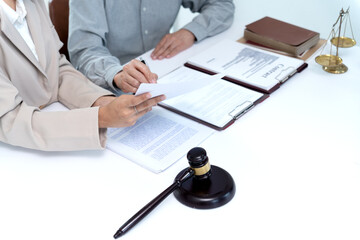 client is reading and studying the legal documents that the lawyer