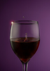 glass of red wine with drops