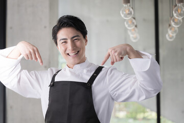 Image of an Asian chef in an apron or a man working in the restaurant industry Recommended here for job change and hiring.