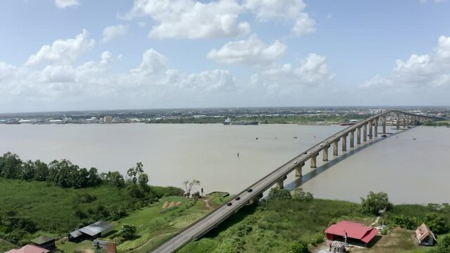 Drone view of Jules Wijdenbosch bridge captured with mavic 2 pro, orbiting around bridge, Suriname river in port of Paramaribo, capital of Suriname