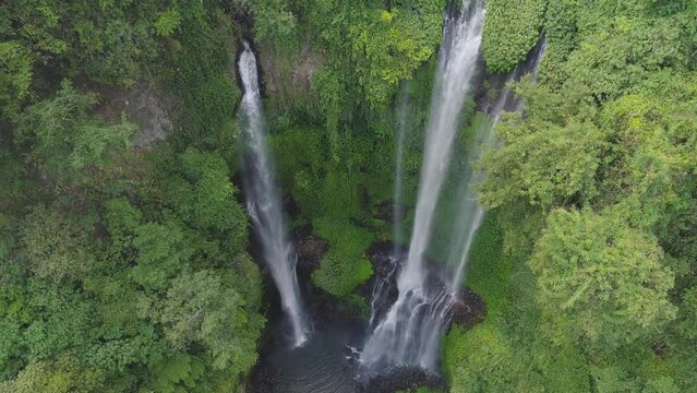 waterfall in green rainforest aerial view triple tropical waterfall sekumpul in mou 4K 