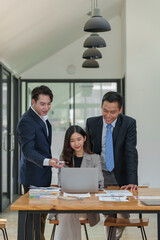 Group of diverse businesspeople brainstorming meeting Ideas, and creative ideas to discuss the situation in the online market working in the office.
