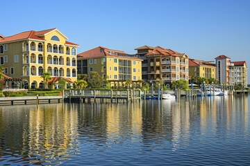 A waterfront condominium complex overlooking a serene lake or ocean, with luxury apartments, private marinas, and resort-style amenities, Generative AI