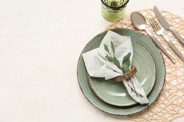 Beautiful table setting with leaves on white background © Pixel-Shot