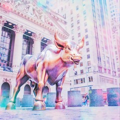 Golden bull statue on Wall Street at sunset, symbol of rising stock markets