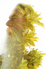 A creative double exposure profile portrait of an old man with a beard