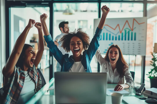 Joyful team celebrates a successful achievement in the office, with hands raised in victory. Employees celebrates their success, acheive target concept