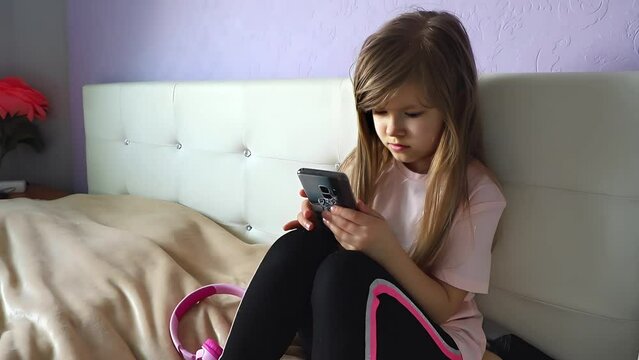 Cute girl preteen use the mobile phone for social media
