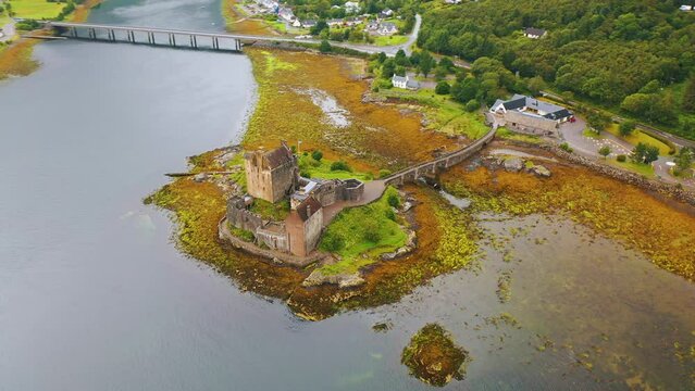 Aerial Drone Shot Orbiting Eilean Donan Castle on Scottish Loch, Scotland Video