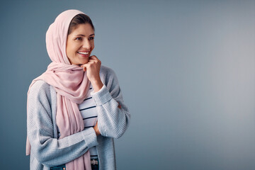 Fashion, woman and hijab in studio, smile and isolated on gray background. Head scarf, Ramandan and...